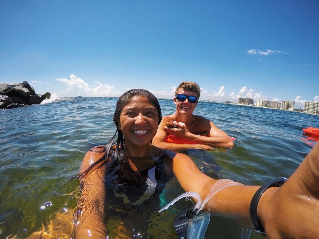 two people smiling at the camera for a picture 