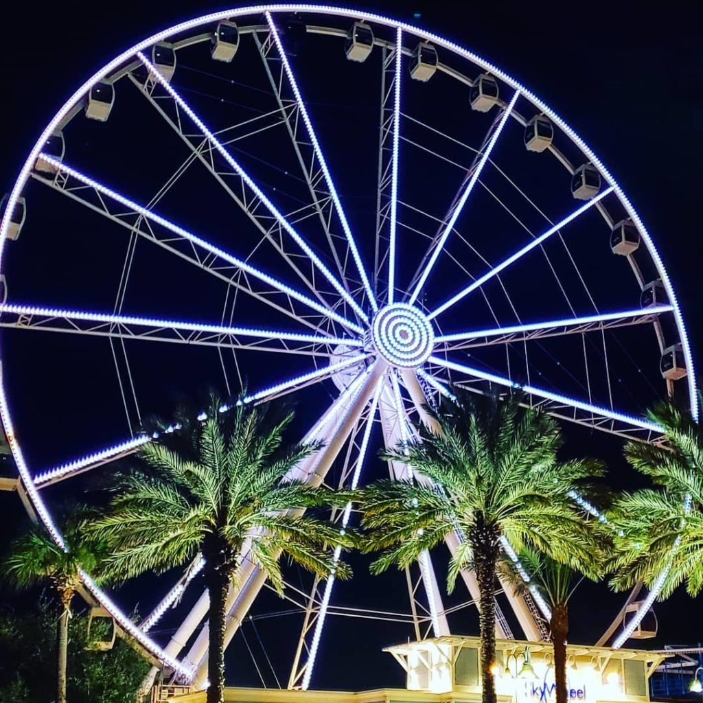 a ferris wheel with lights that light up 