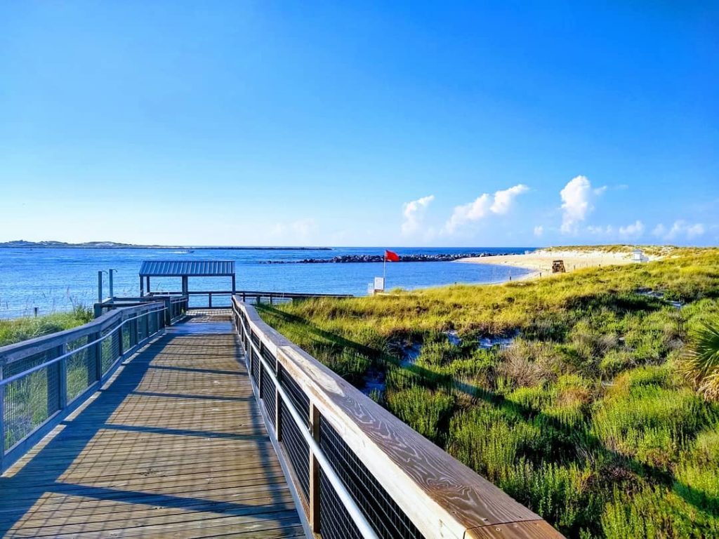 a wooden walkway down to the beach