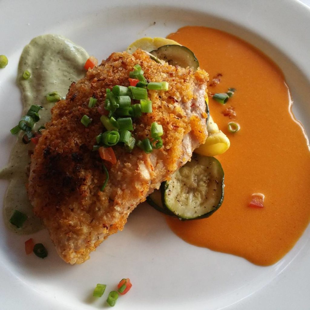 pan seared crusted redfish with cayenne butter, chives and veggies