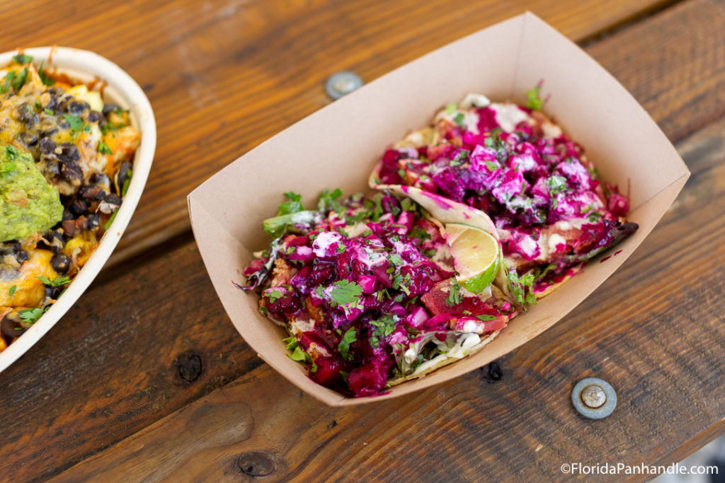 Tacos with bright purple cabbage and a slice of lemon at Finn's Island Style Grub in Panama City Beach