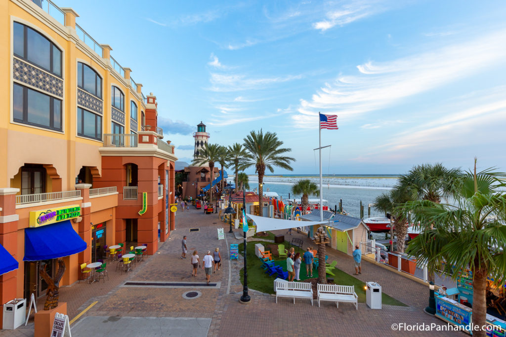 an overview of a shopping strip next to the beach