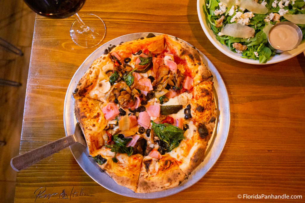 a supreme pizza with spinach shallots and mushrooms at Pazzo Italiano