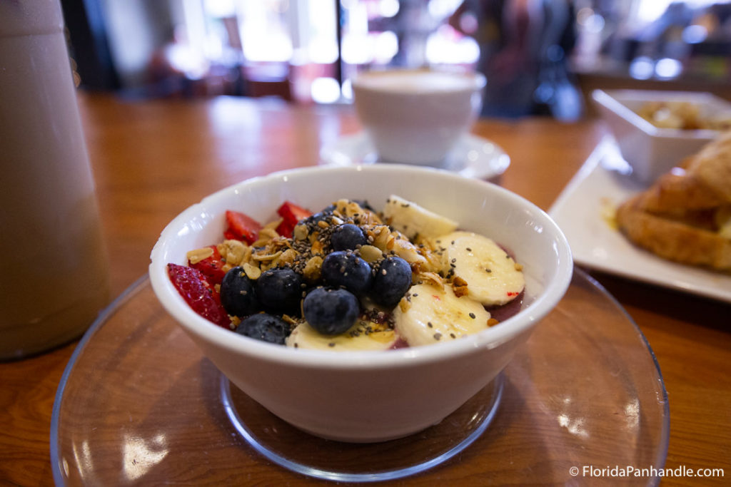 a smoothie bowl with strawberries, banana's, blueberries and granola on top