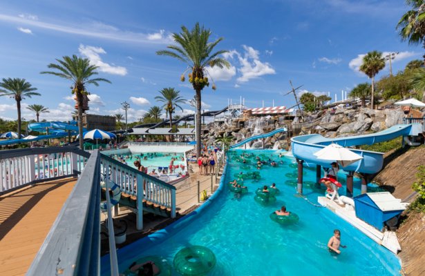 an amusement park with a big lazy river with people floating on it at Big Kahunas 