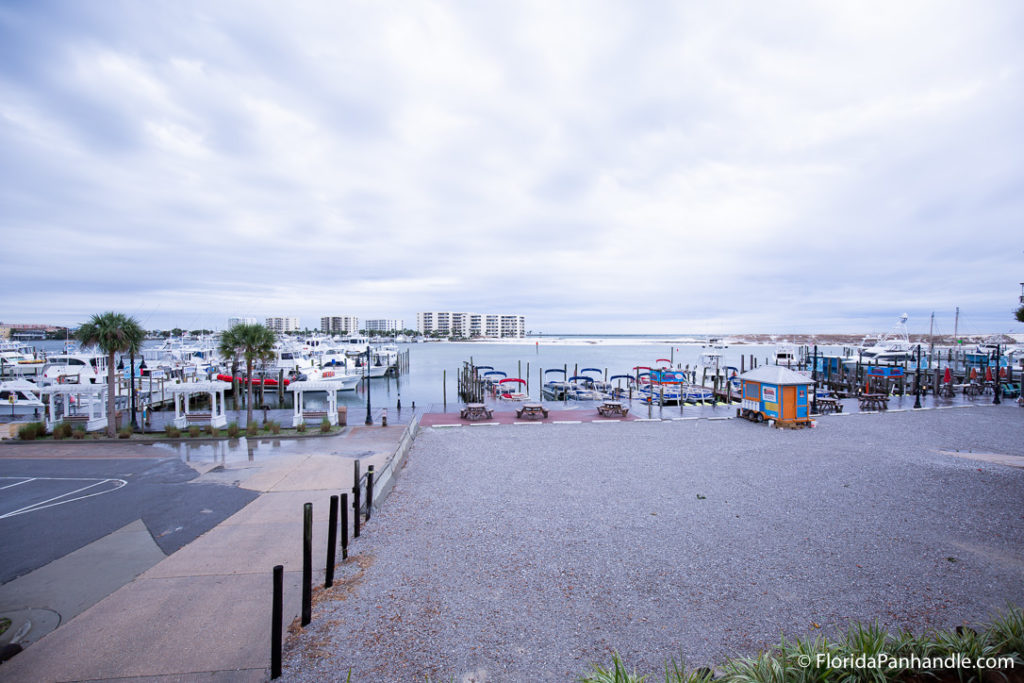 an empty parking lot with a boat parking area in front on the water in Destin, Florida
