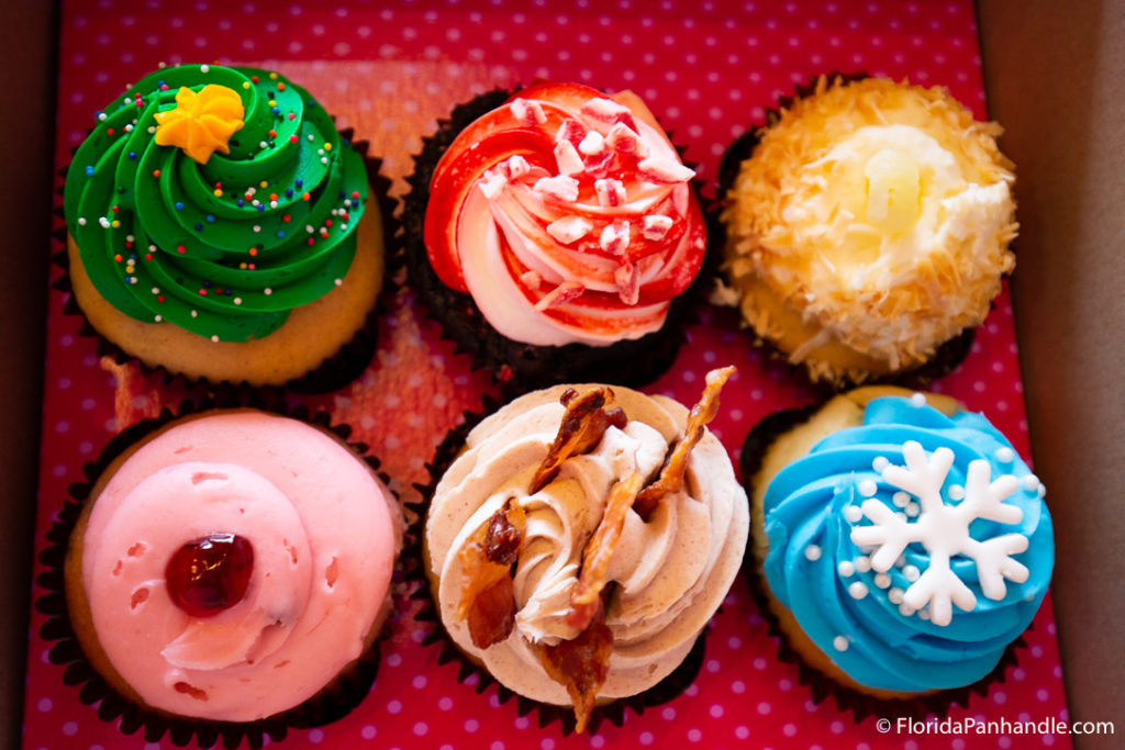 a variety of cupcakes in a box