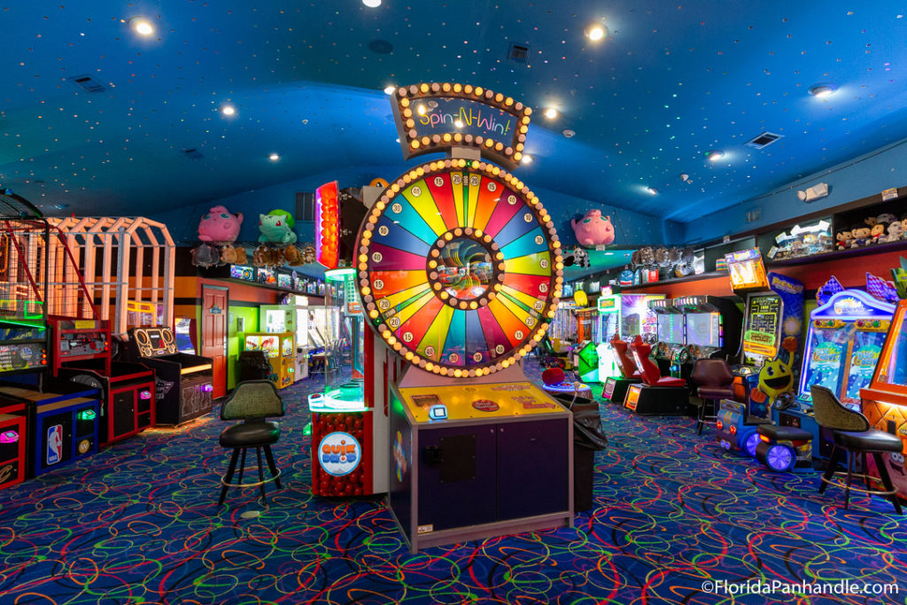 spin n win arcade game in an arcade room with other games