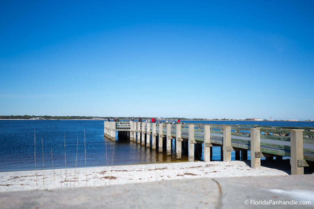 a boardwalk leading out over the water