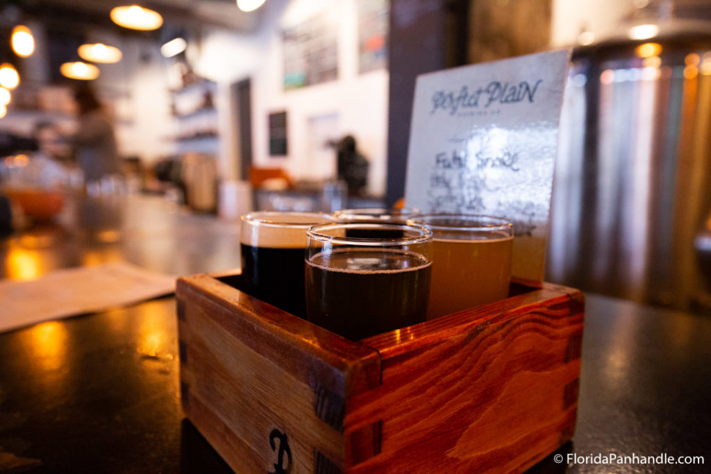 brews inside of wooden box with menu in the background