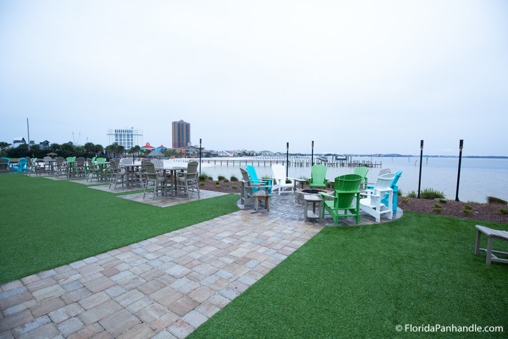 an outdoor seating area right next to the water