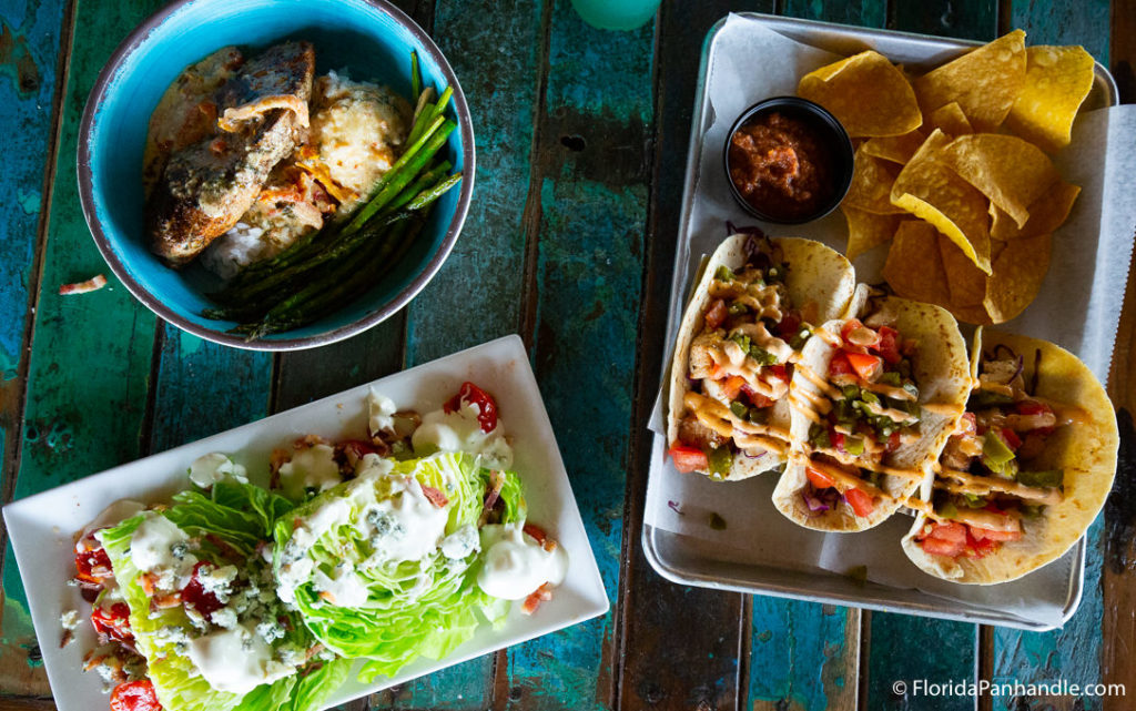 plate of tacos with chips and salsa and a side of cob salad at Red Fish Blue Fish 