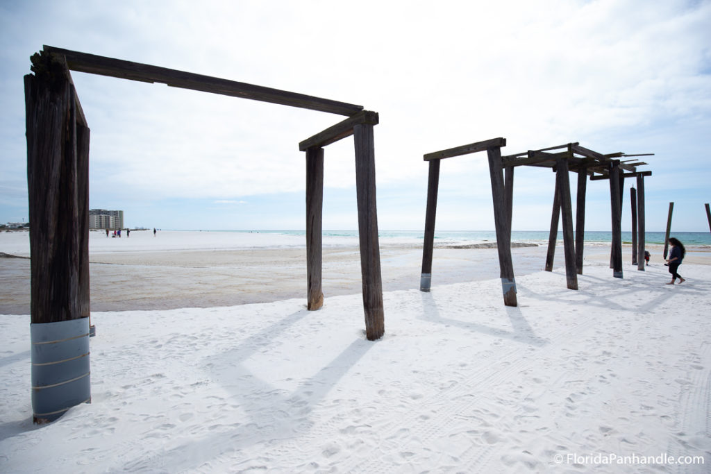 wooden structures on the beach possibly an old pier at Camp Helen State Park in Florida 