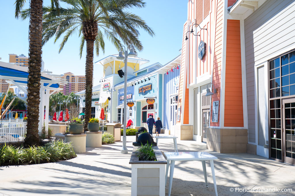 a sidewalk at pier park by shopping malls