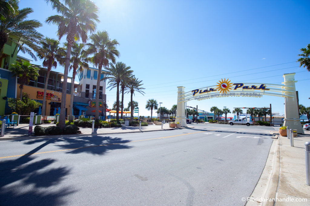 view of the pier park sign from the street during the day in Panama City Beach. Florida