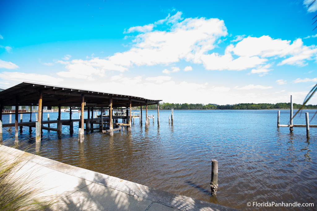 waterfront view, sunny day, wooden dock