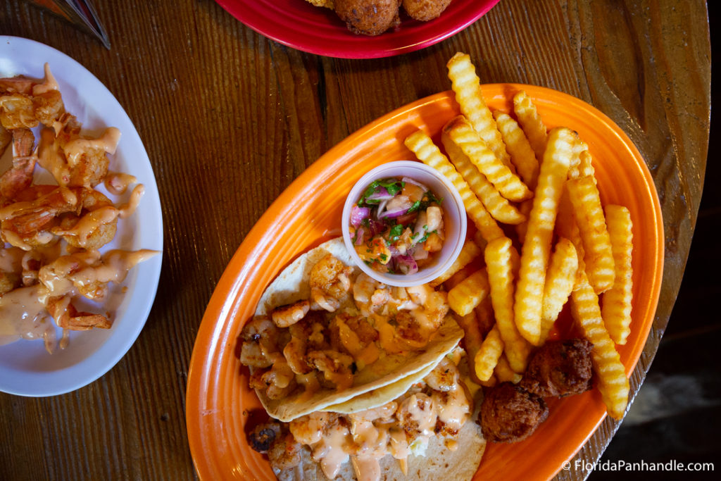 plate of french fries and fish tacos