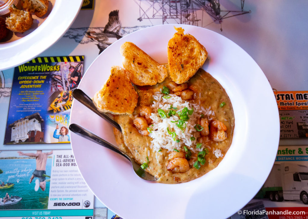 cajun style dish with shrimp, rice and grilled toast on the side at dat cajun place