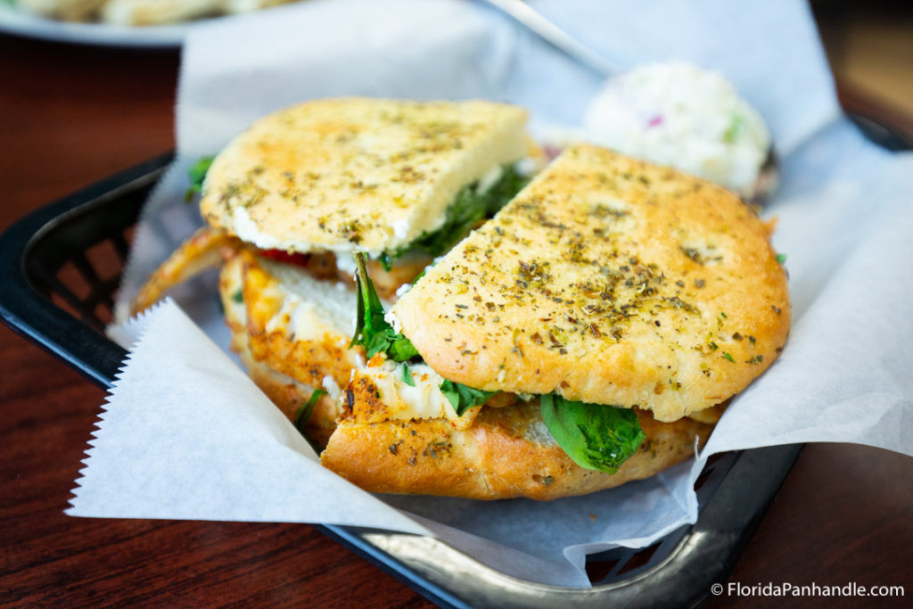 sandwich with herb crust in platter for brunch at liza's kitchen in florida