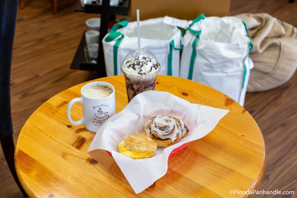 a cinnamon roll and egg breakfast sandwich with a hot coffee and a frozen coffee at Roasters Edge Coffee Roastery & Deja Brew Coffee Shop 