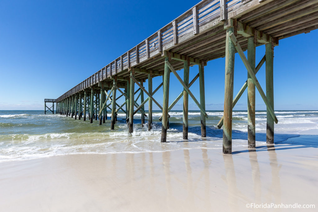 a view of a pier from the beach in pcb