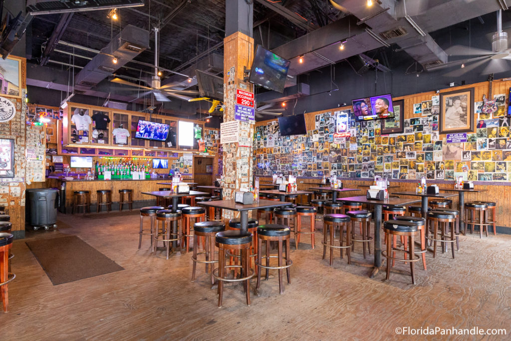 tables and chairs inside tootsies orchid lounge in panama city beach