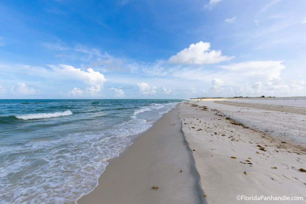 view of the ocean from the beach on a sunny day 