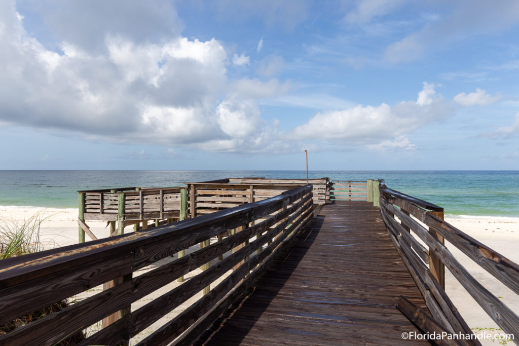 a wooden pier at William J Rish Park