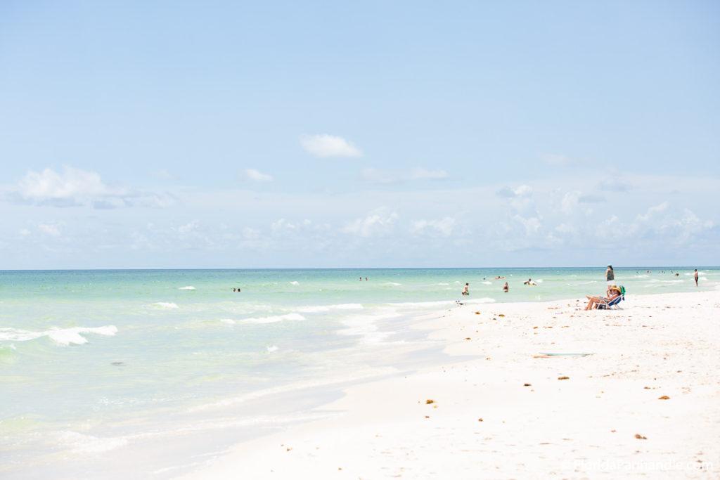 tourists at Cape San Blas beach in the water on a sunny day