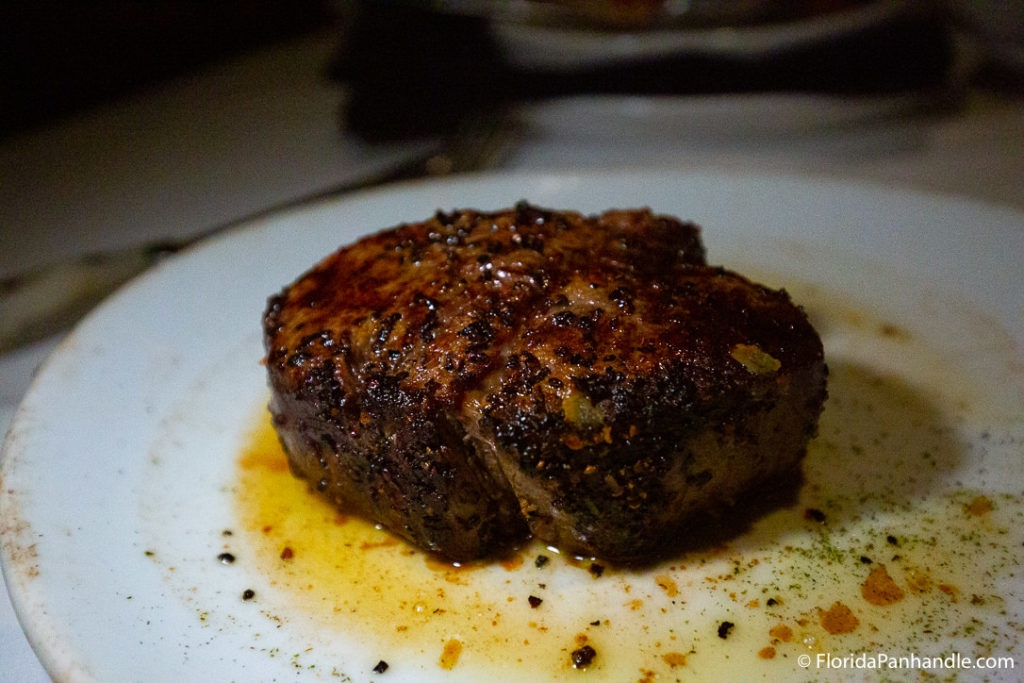 a beautifully crusted seared steak at Fleming's Prime Steakhouse and Wine Bar