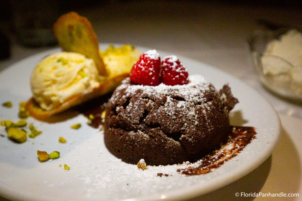 chocolate dessert with powdered sugar and raspberries on top, Upscale restaurants in destin