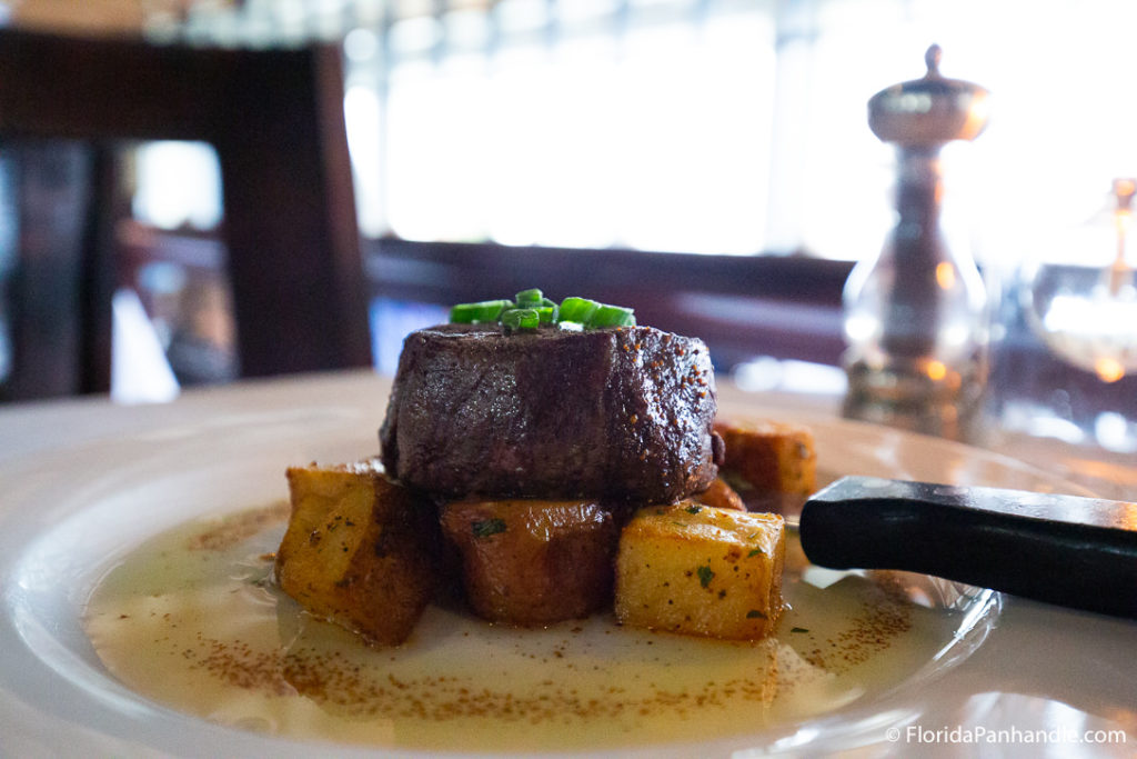 a plate of steak with cubed potatoes on the side, Upscale restaurants in destin