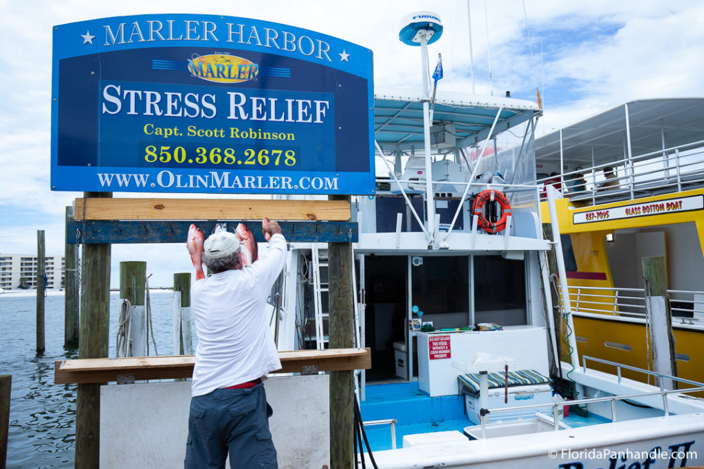 the entrance to a fishing charter tour