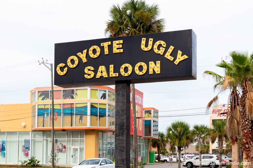 a sign of Coyote Ugly Saloon on the beach strip in Panama City Beach Florida 