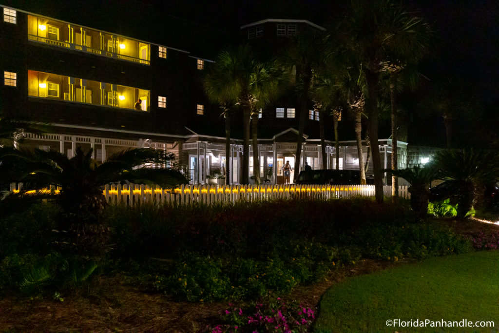 view of a building at night with lights lit up