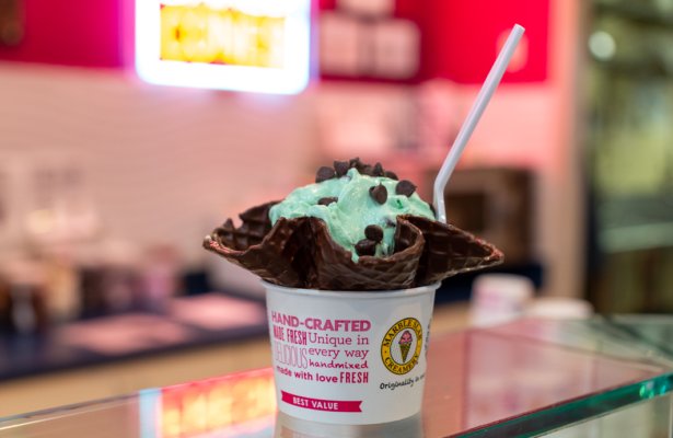 a cup of mint chocolate chip ice cream in a chocolate waffle cone at Marble Slab Creamery in Destin, Florida