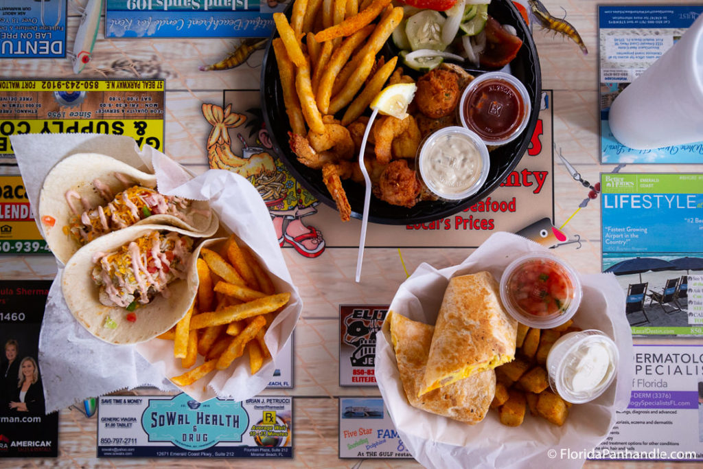 a plate of tacos with a side of fries at Stewby's Seafood Shanty