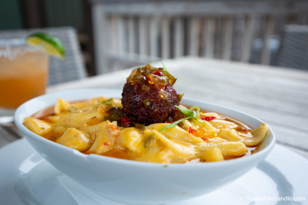 fried ball on top of seafood soup dish in florida