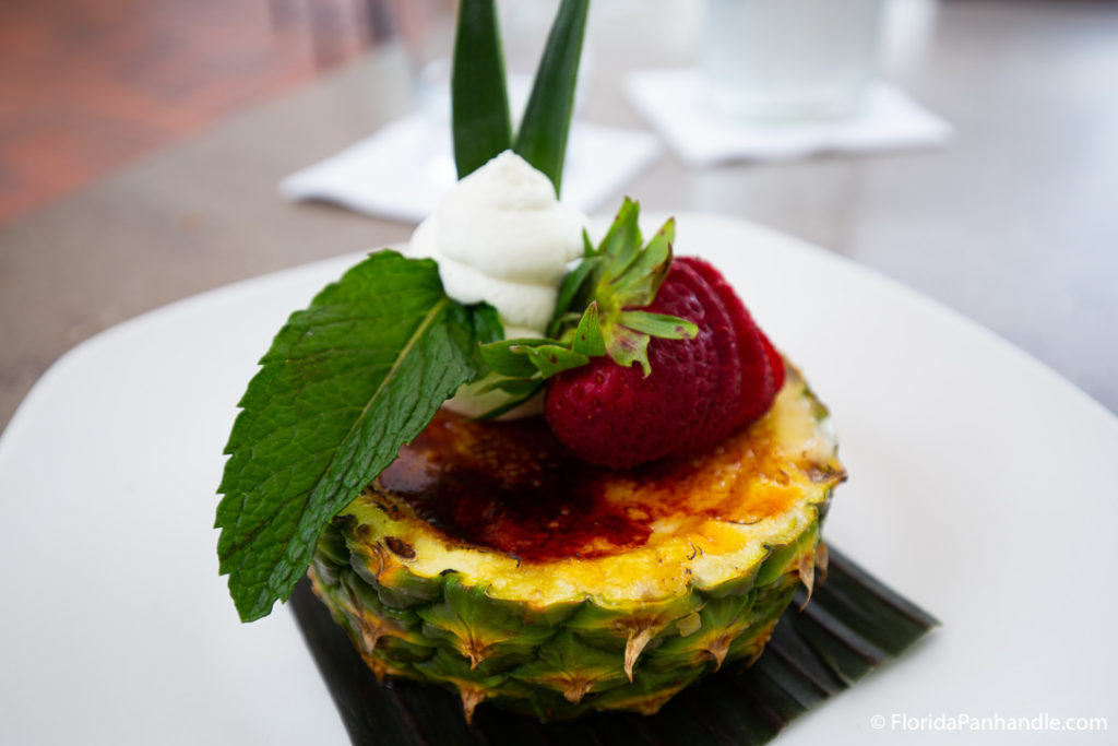 pineapple cut open with strawberries and whipped cream on top, Upscale restaurants in destin