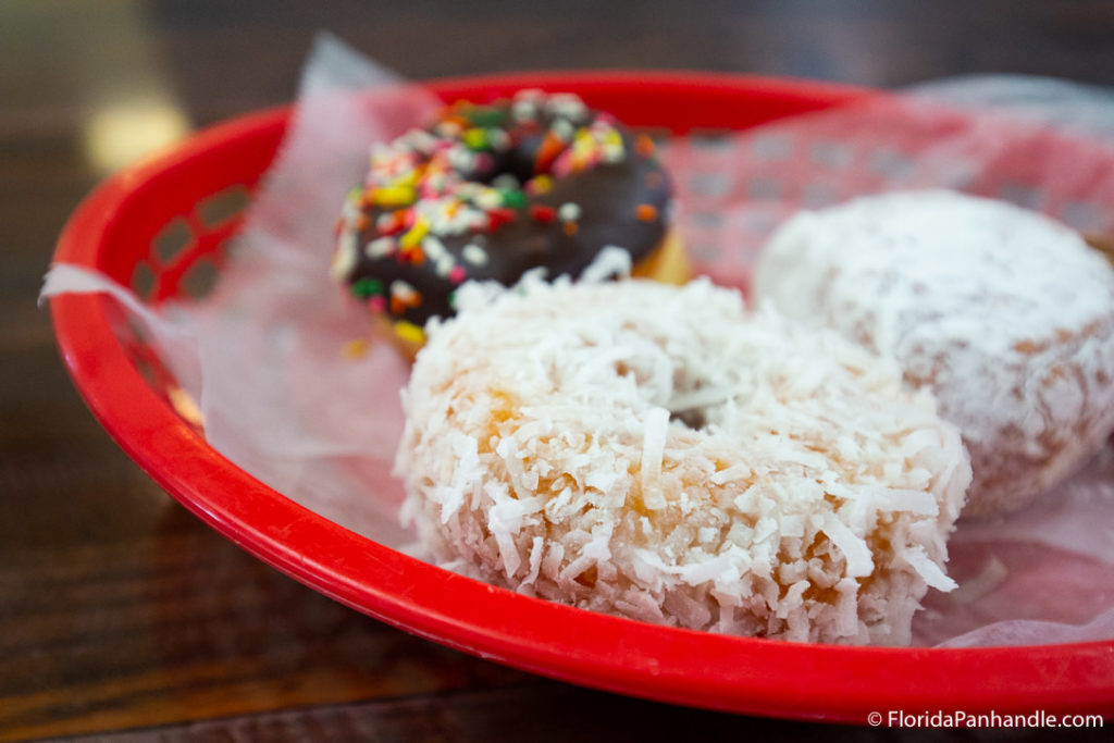 a coconut smothered donut from Donut Hole in Panama City Florida