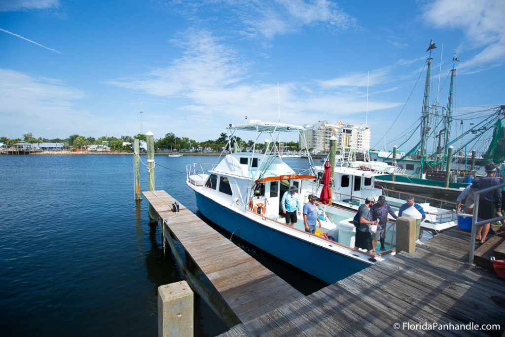 deep sea fishing in destin, florida, boat out on the water, dock