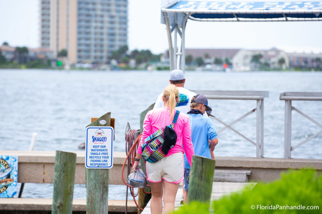 people walking on a dock