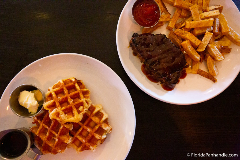 two plates of food, waffles, fries, steak, south market, pensacola, florida