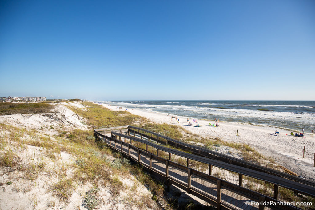 a boardwalk leading down to the beach