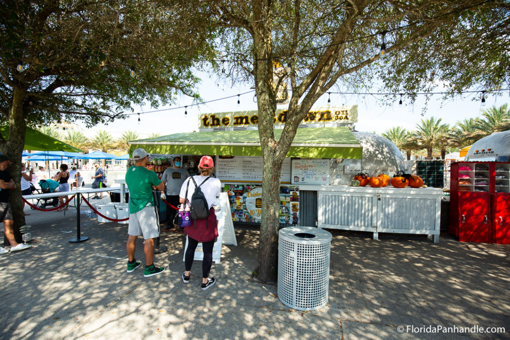 exterior of meltdown 30a with people waiting in line