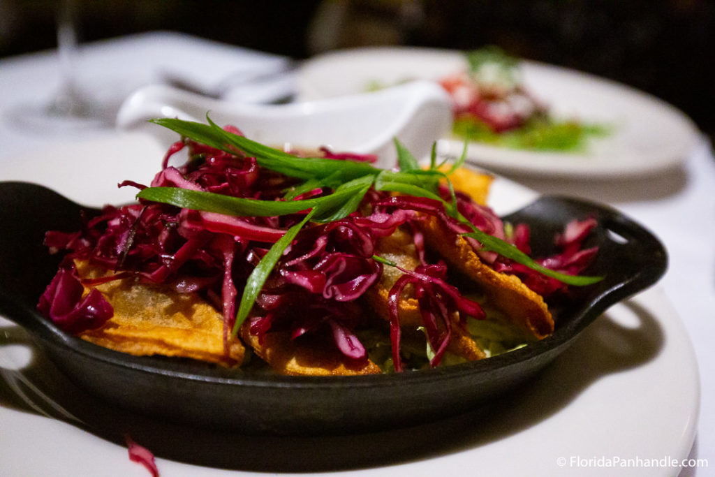 tortilla chips with slaw on top inside black iron skillet at cafe thirty-a in 30a florida