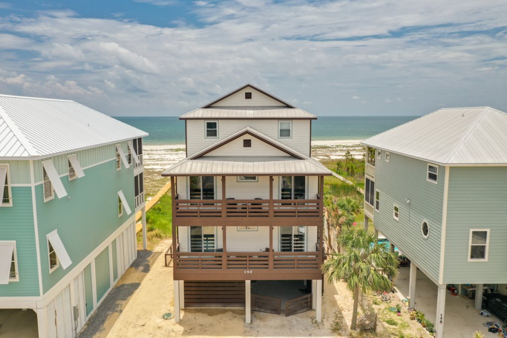 view of a vacation rental house in cape san blas with wooden decks and patios 