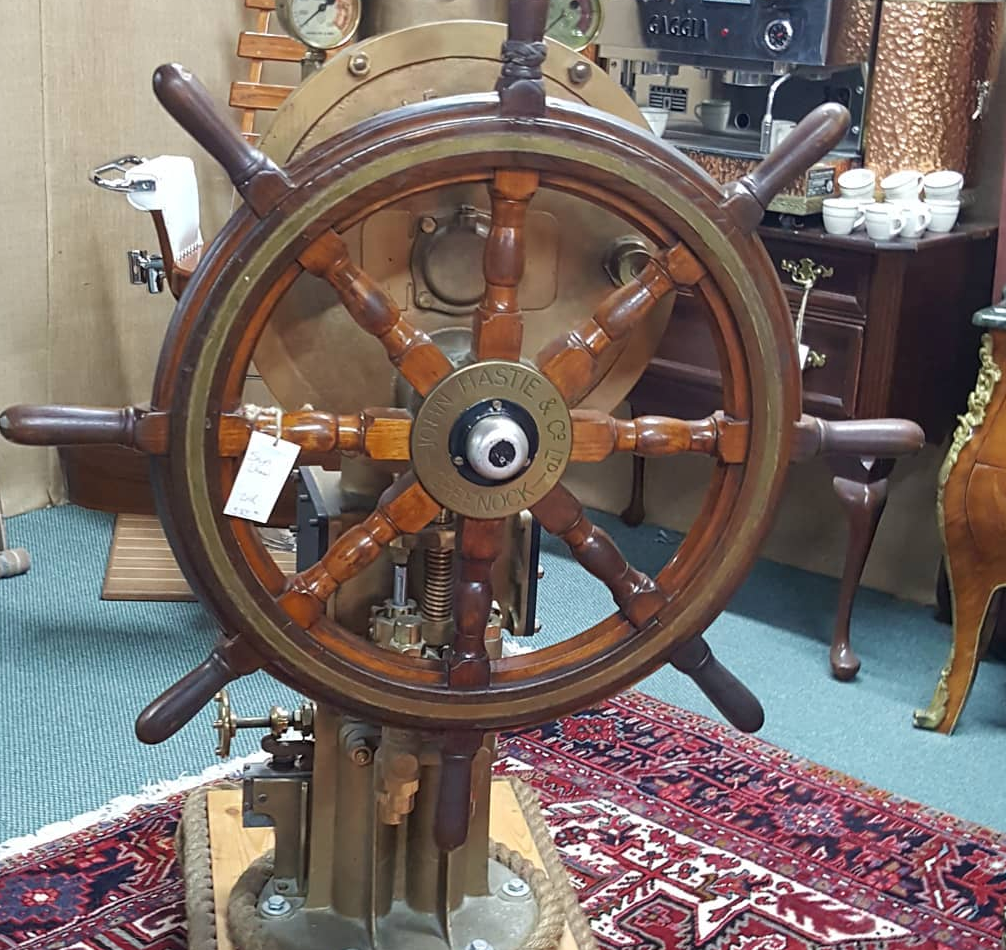 a wooden wheel that belonged to a fishing ship
