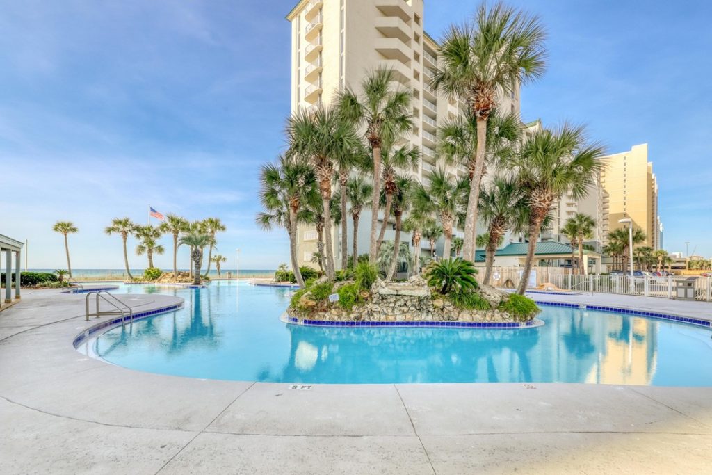 long beach resort tower with large pool and beach views