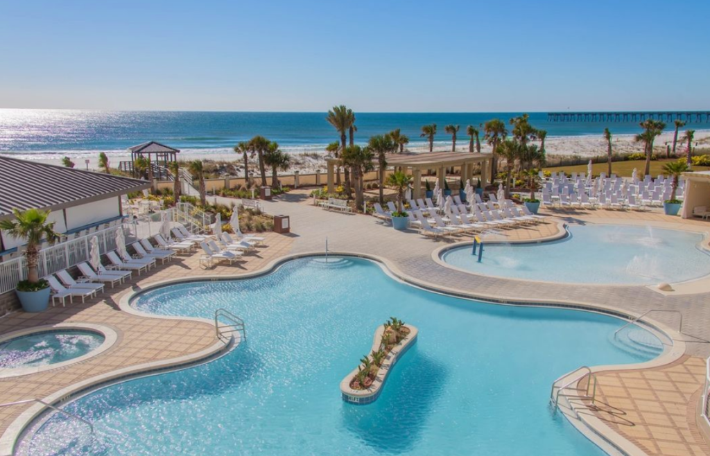 view of a resort style pool, beach, ocean, views, 
